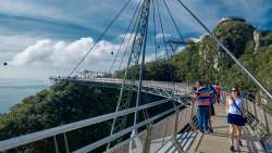 <p>Langkawi Sky Bridge is a 125-metre curved pedestrian cable-stayed bridge in Malaysia, completed in 2005. this suspended bridge is built on top of the Machinchang mountain. Accessible from the Top Station, the bridge is suspended from a 82m high single pylon, hangs at about 100m above ground and it can accommodate up to 250 people at the same time............</p>
